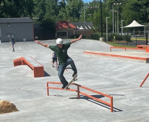 Skateboarder performs a trick on a grind rail on June 7, 2021 at the new Rockville Skate Park.