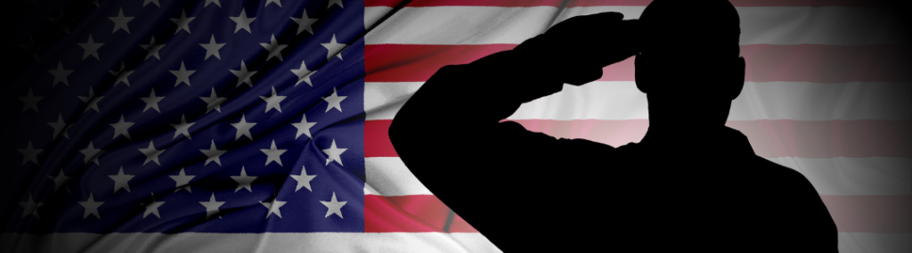A man saluting with an American flag in the background