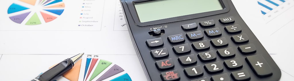 Closeup of a calculator and budget paperwork