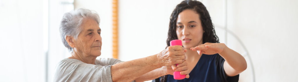 An older woman with her physical therapist