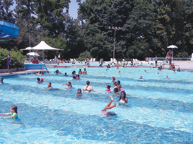 Swimmers playing in a pool at the Rockville Swim & Fitness Center