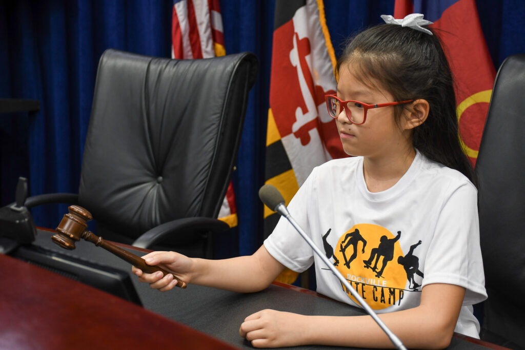 Girl sitting at the Mayor and Council dais