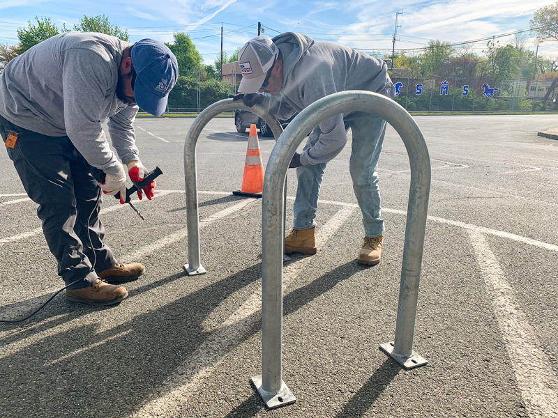 Men installing bike racks