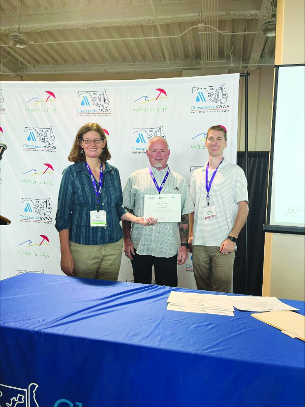 Water treatment plant employees accepting an award